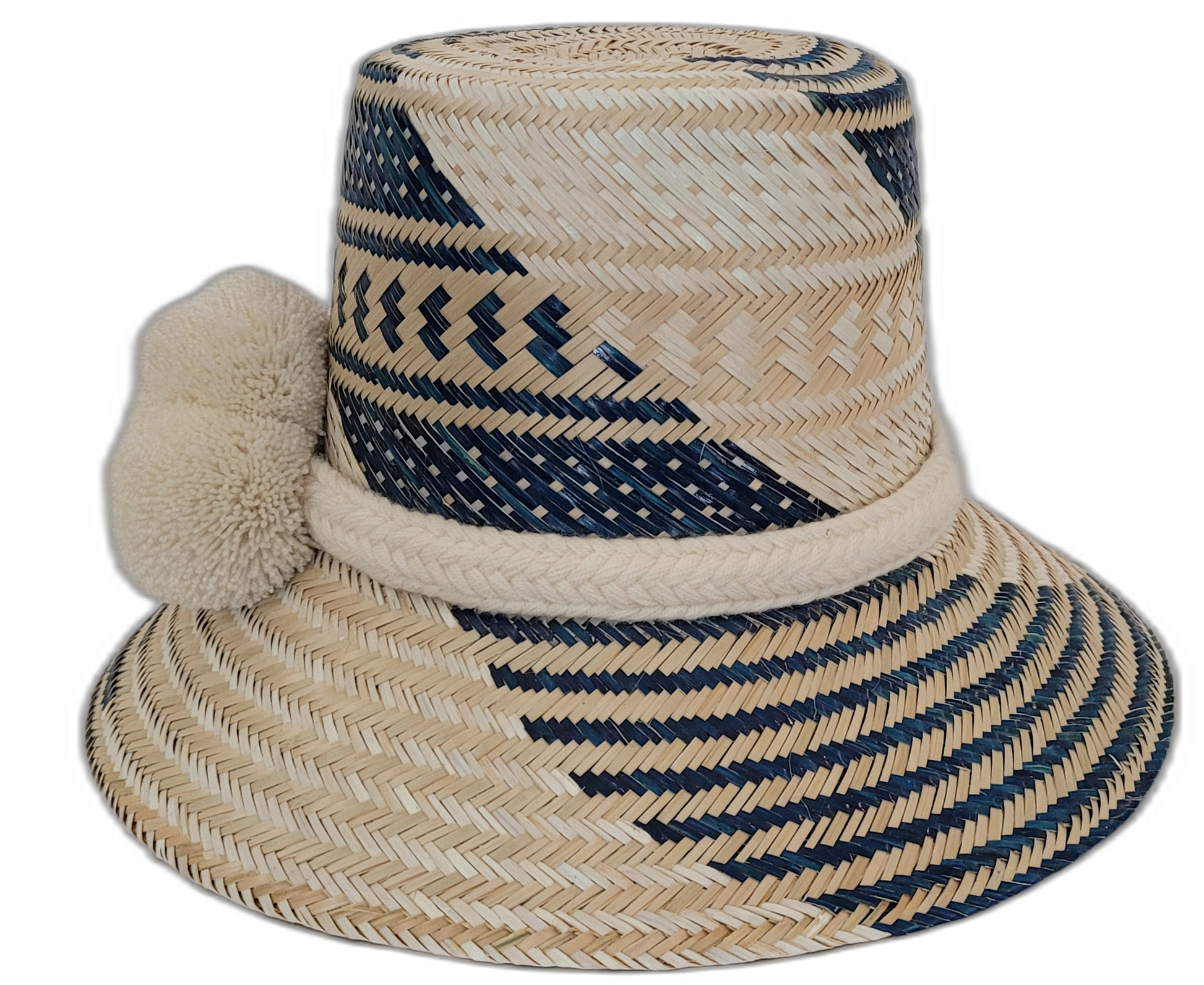 Bohemian chick straw hat from the Wayuu tribe, featuring colorful patterns and pompoms