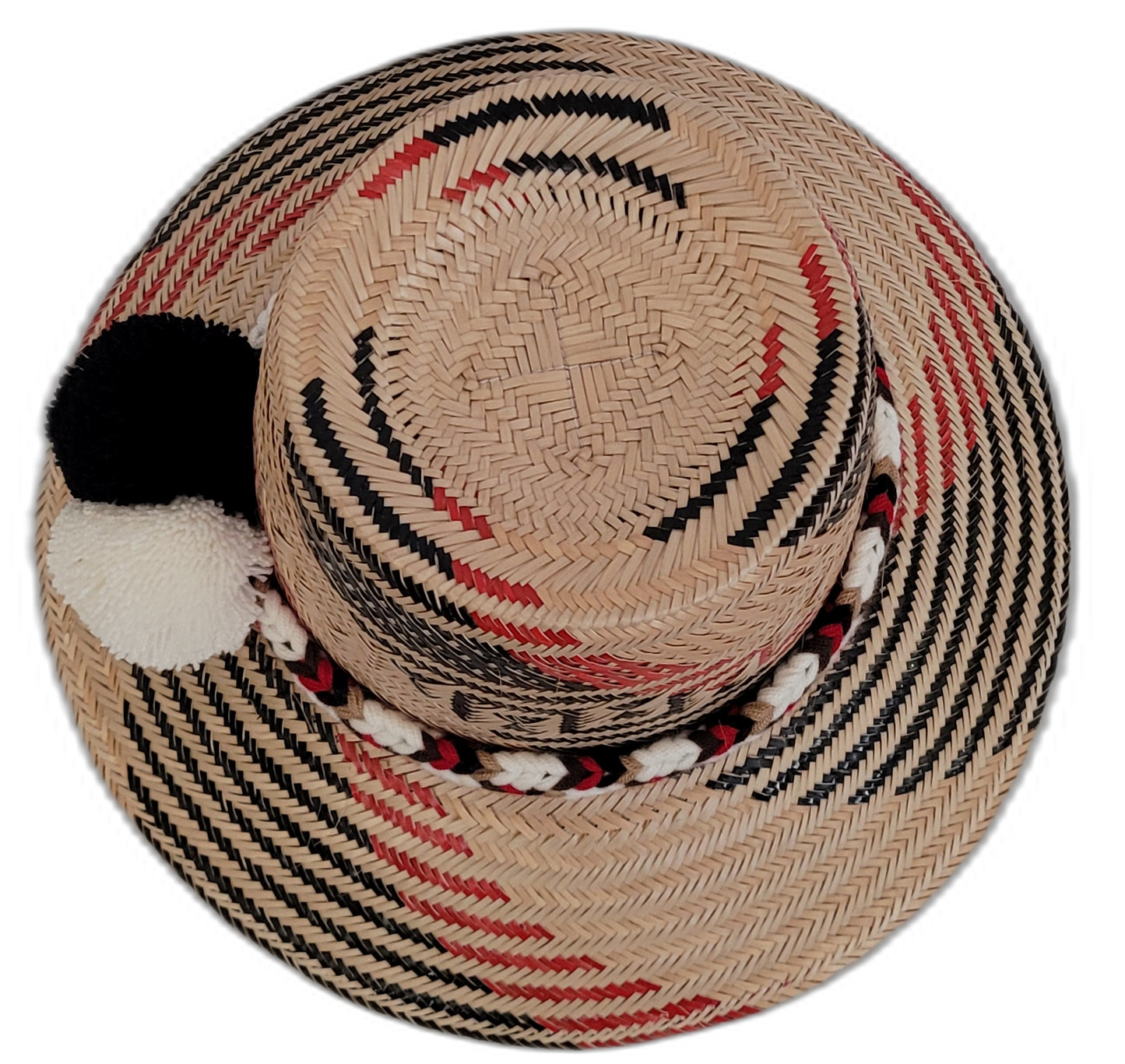 Boho straw hat with black, white, and red design, handwoven by Wayuu artisans.

