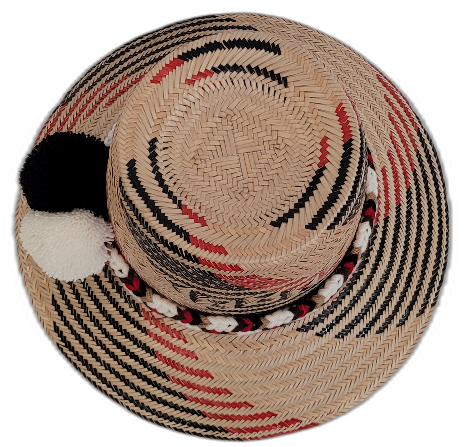Boho straw hat with black, white, and red design, handwoven by Wayuu artisans.

