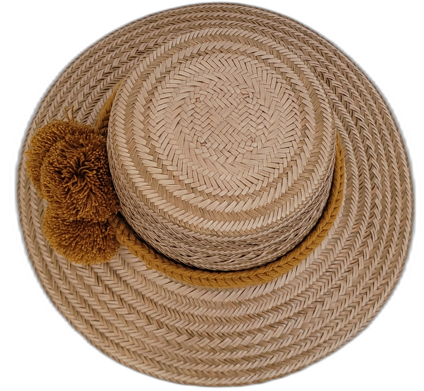Wayuu artisan straw hat featuring natural tones and golden pompoms for boho style.

