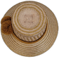 Handwoven Wayuu straw hat with golden accent pompoms and bohemian design.


