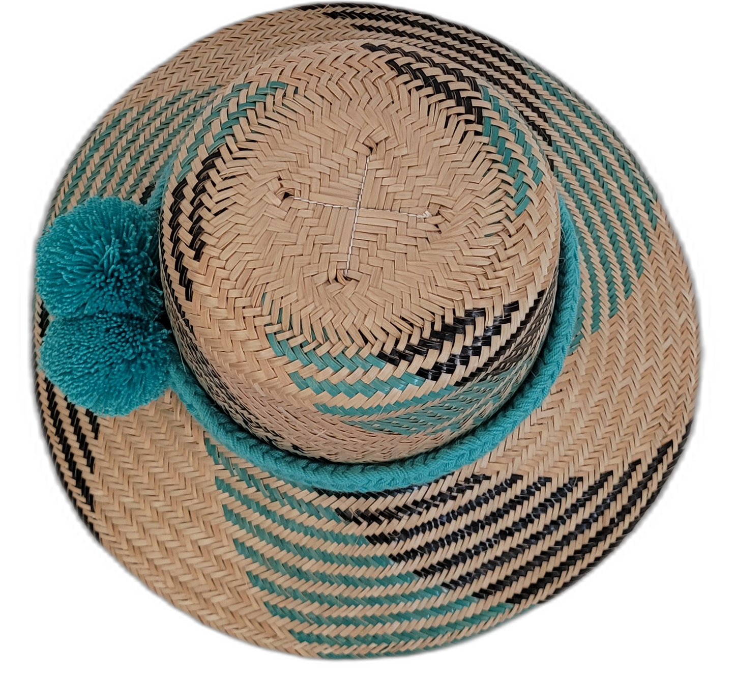 Handwoven Wayuu straw hat with turquoise accent pompoms and bohemian design.

