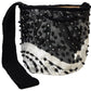 Beaded Wayuu bag with wavy embroidery, black strap, and handmade details.