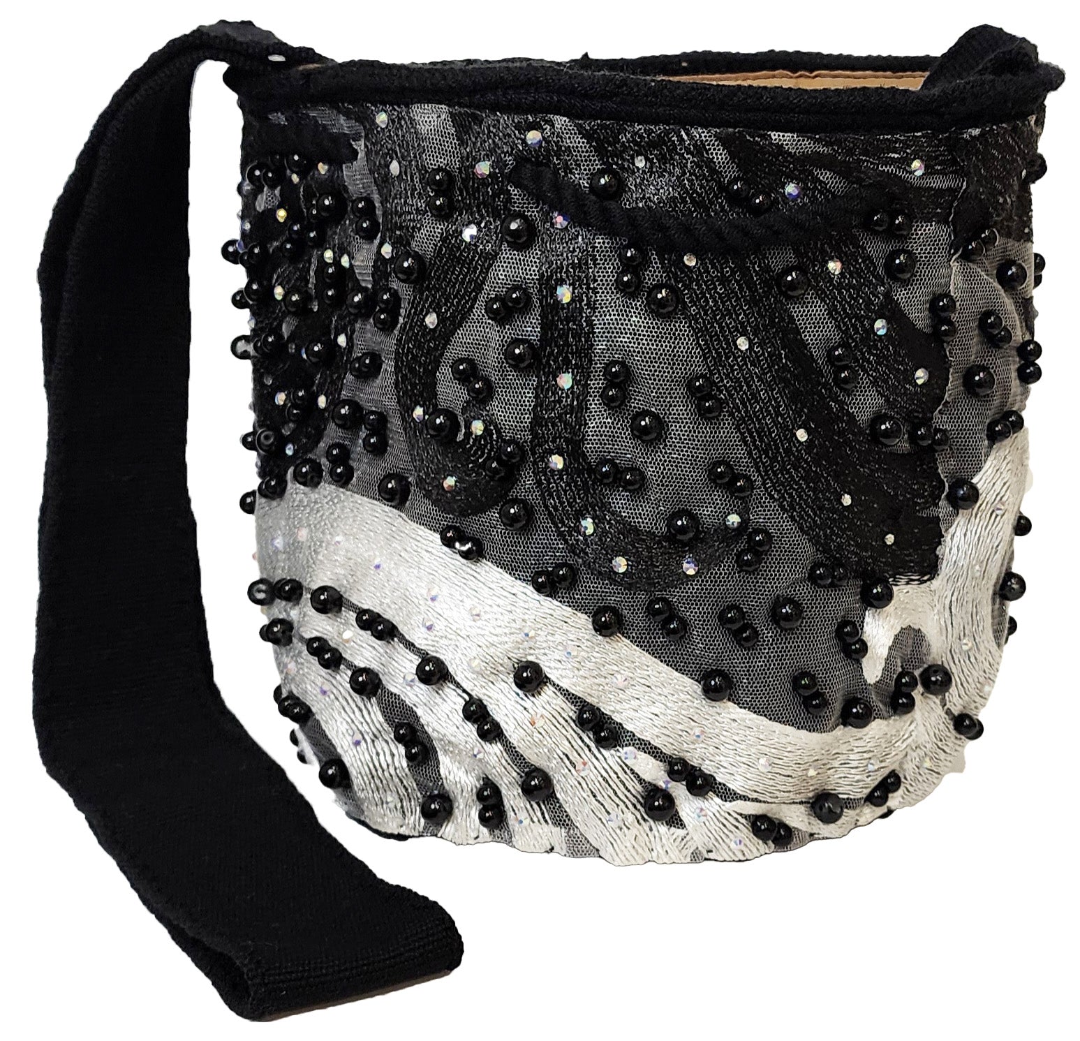 Bottom view Beaded Wayuu bag with wavy embroidery, black strap, and handmade details.