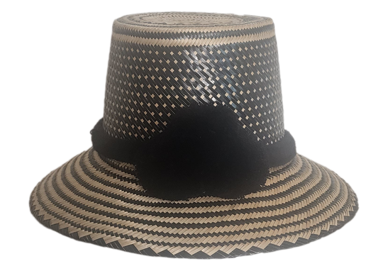 Handmade boho straw hat with black pom-poms and minimalist geometric weave