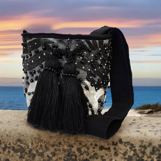 Handmade Wayuu crochet bag with black and silver embroidery and beads.

