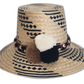 Handmade Wayuu hat with black and white geometric weave and pompoms