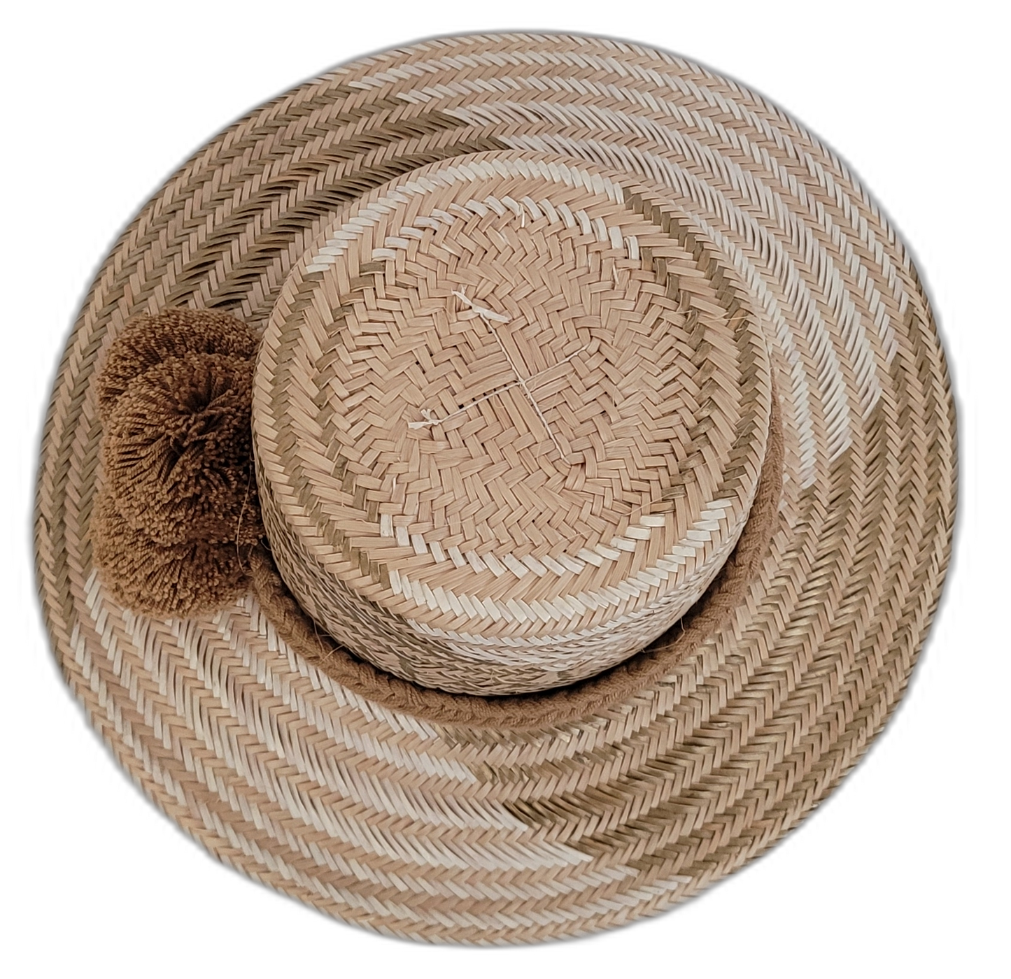 Elegant earthy Wayuu straw hat with handmade details and brown pompoms.

