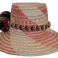 Boho chick straw hat with coral pink accents and earthy tones