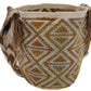Elegant Wayuu bag with a gold crystal-studded design and artisan shoulder strap.