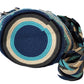 Bohemian handmade crochet bag with blue tones, tassels, and crystals.