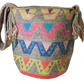 Boho crossbody Wayuu bag featuring a rainbow palette and handmade woven strap.