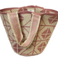 Bohemian pink Wayuu bag with dual straps, perfect for everyday or beach style.