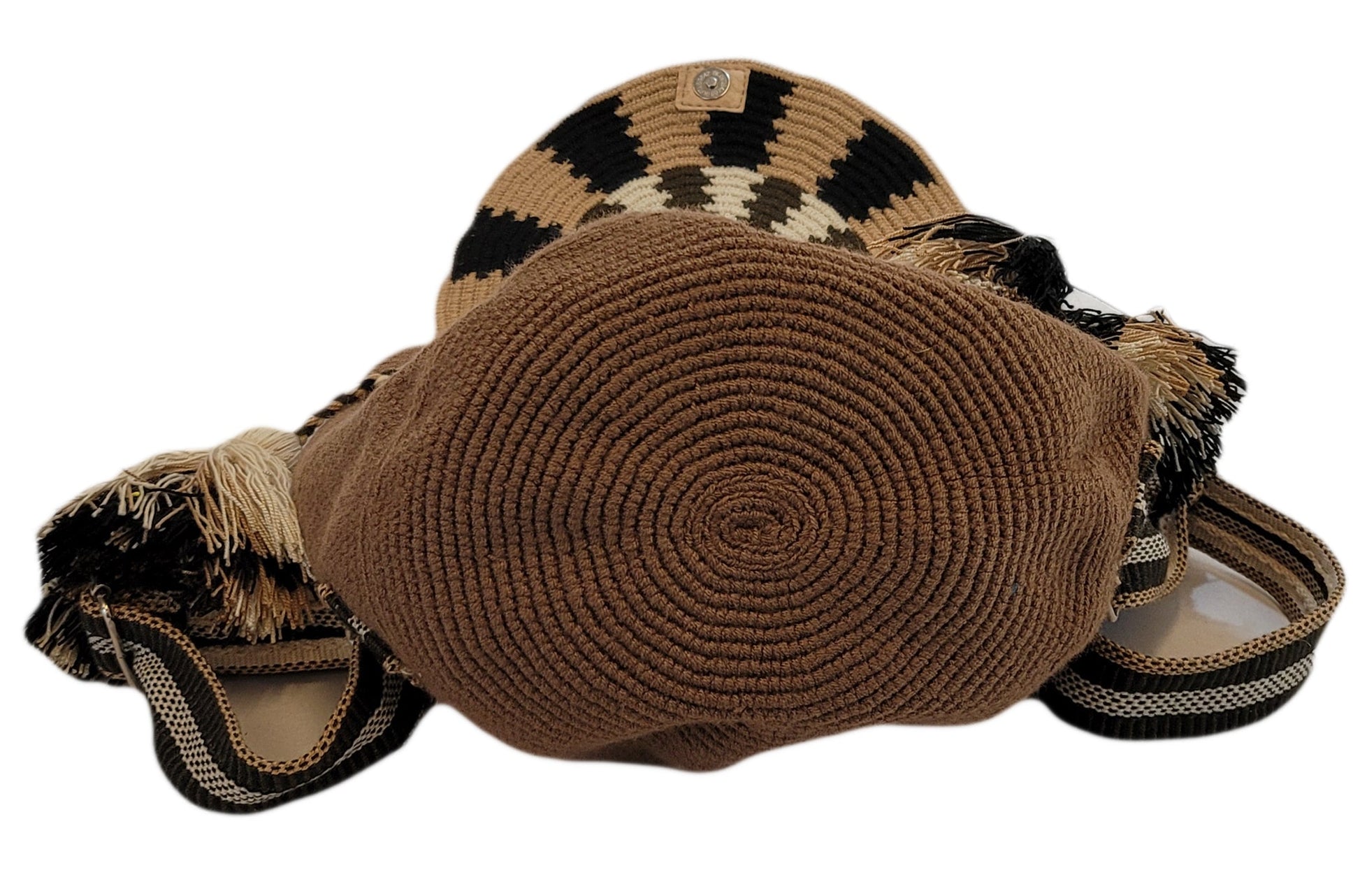 Neutral-toned Wayuu crochet backpack featuring tribal patterns and soft straps.