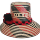 Colorful bohemian Wayuu hat with cultural pompoms and tribal weave