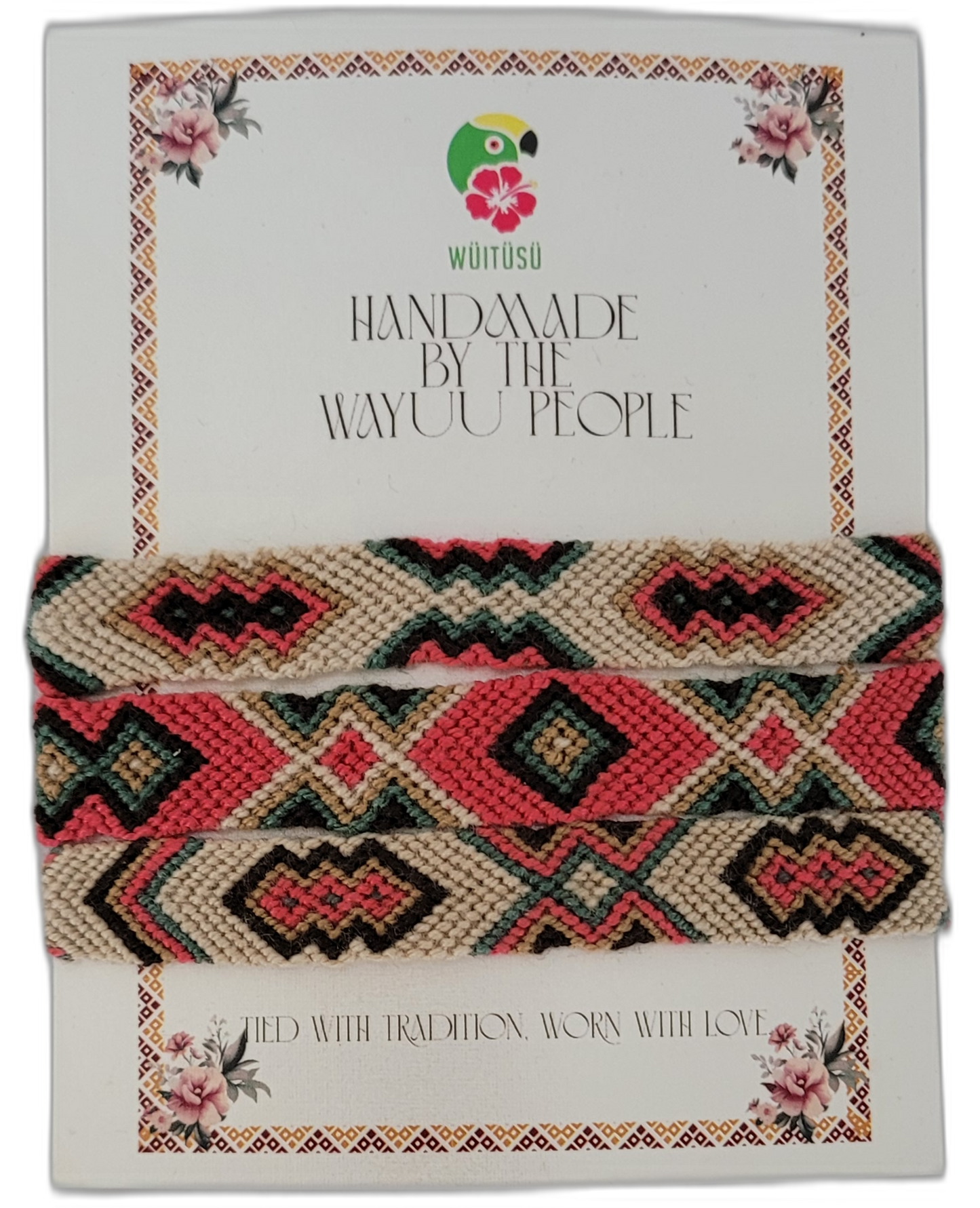 Bohemian handmade Wayuu friendship bracelet with bold tribal patterns in cream, coral, green, and black — a chic artisan piece with symbolic meaning.

