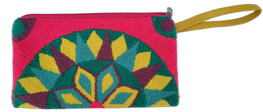Boho crochet Wayuu clutch in a radiant multicolor pattern. Handcrafted using punch needle technique for a textured, eye-catching artisan bag.