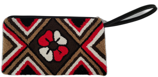 Colorful Boho crochet clutch named Alaya featuring Wayuu artisan work in red and white tones.

