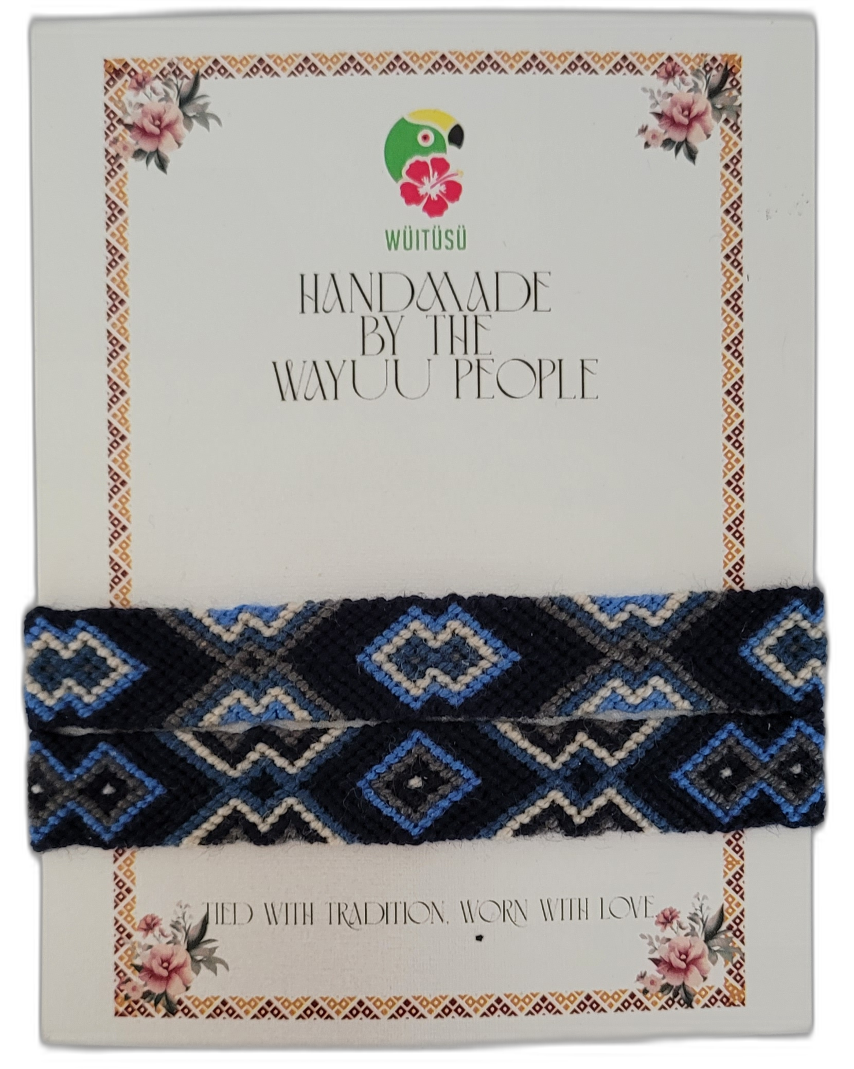 1 Bohemian handmade Wayuu friendship bracelet in black, brown, tan, and cream with geometric tribal patterns — a meaningful artisan accessory blending boho chic colors and ethical craftsmanship.