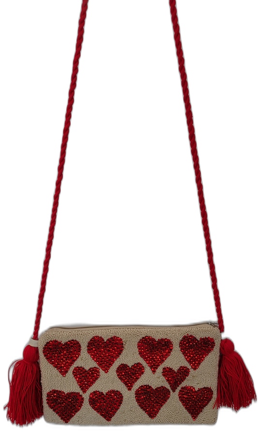 Mikaela handmade Wayuu clutch with red heart embroidery and braided tassel strap

