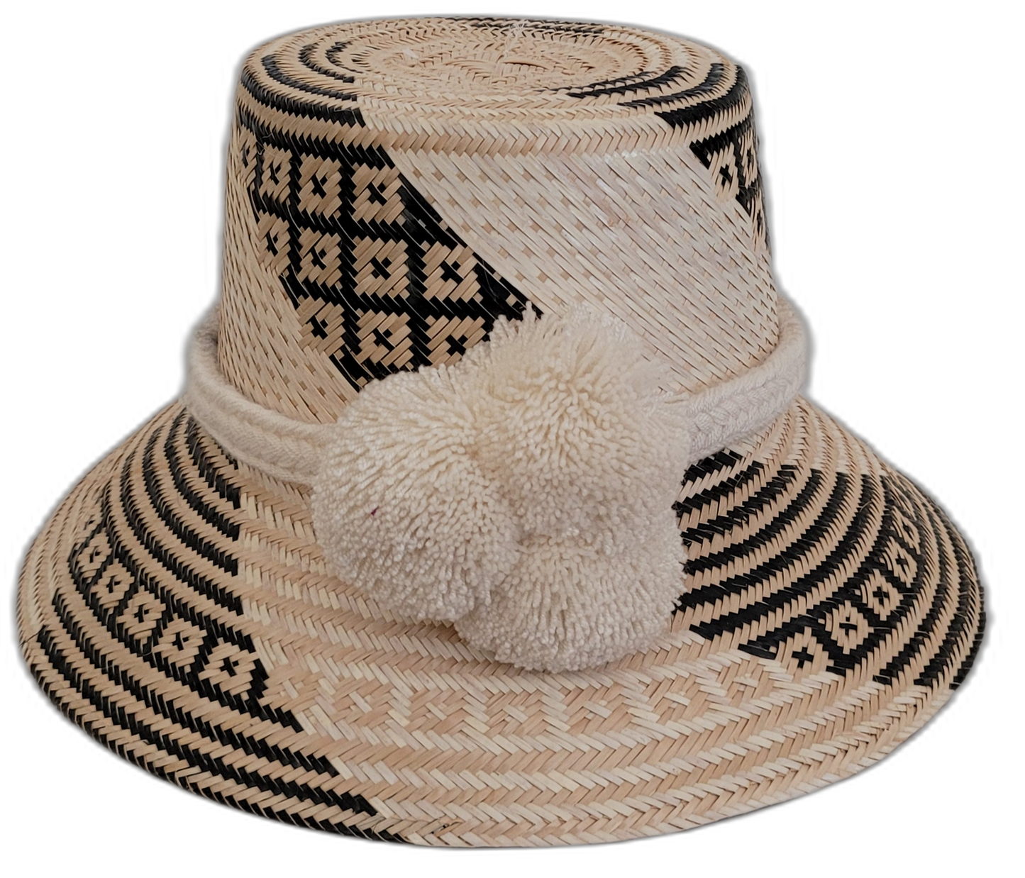 Handmade Wayuu bohemian straw hat with cream pompoms and black-beige geometric woven patterns.

