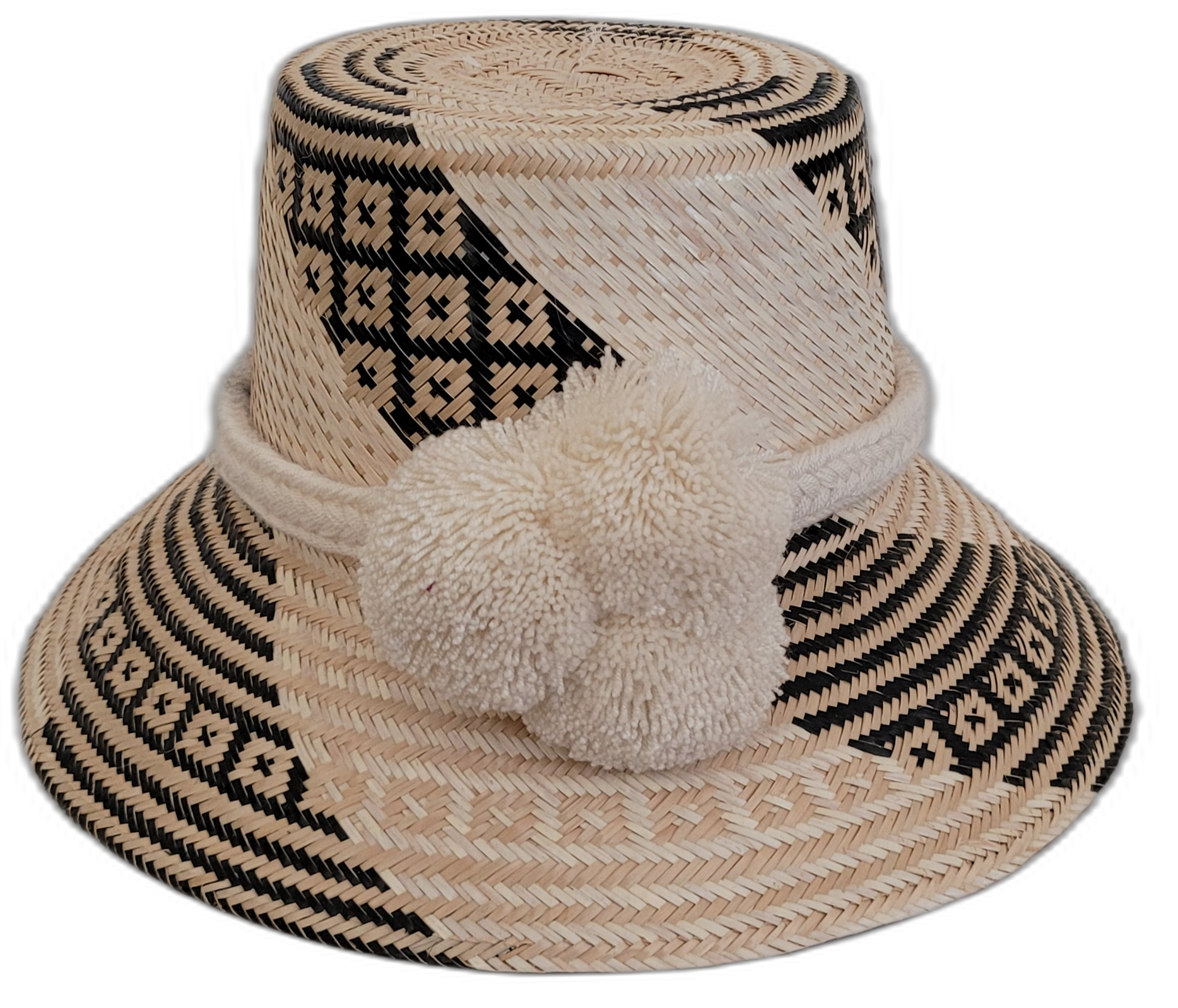 Handmade Wayuu bohemian straw hat with cream pompoms and black-beige geometric woven patterns.

