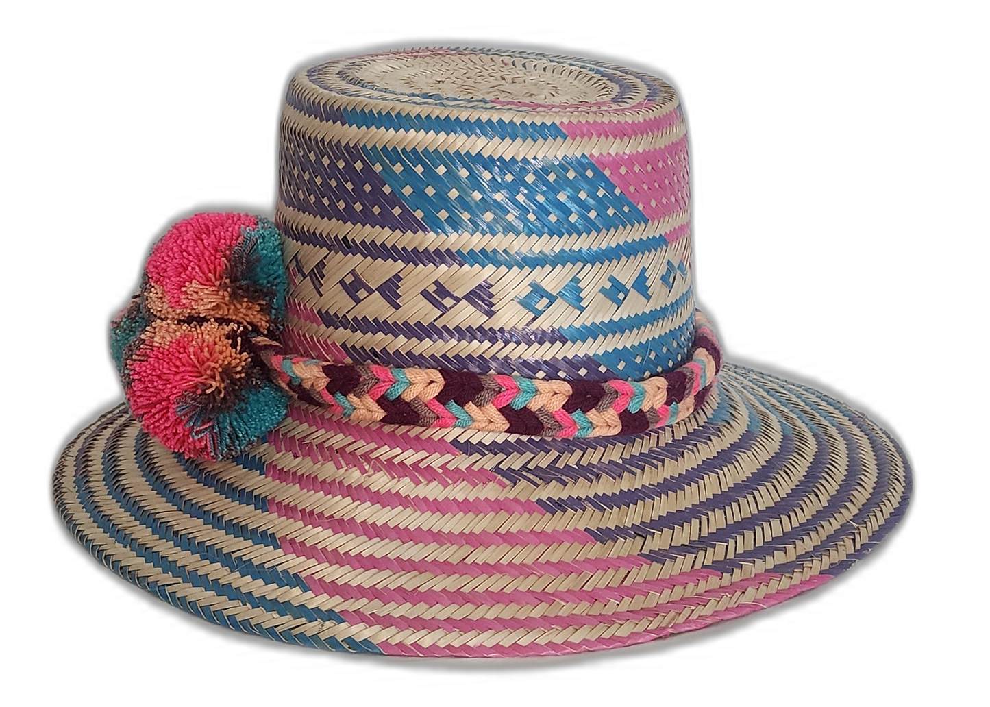 Boho straw hat featuring bright artisan patterns and large pompoms