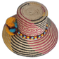 Artisan straw hat featuring yellow stripes and cultural patterns