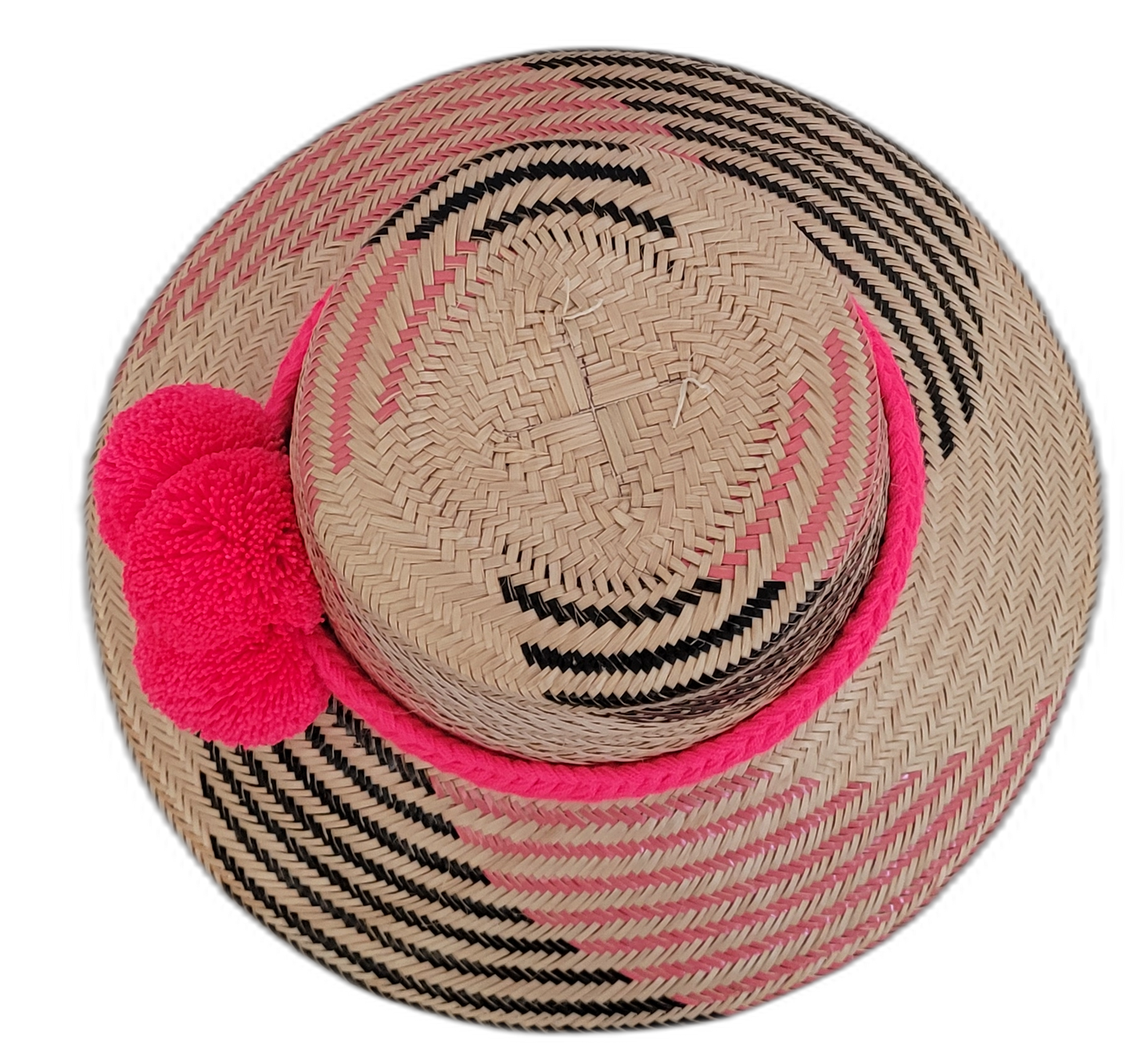 Bohemian straw hat in pink and black, handmade with Iraca palm, decorated with signature Wayuu pompoms, elegant and stylish.
