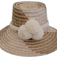 Handmade Wayuu bohemian straw hat with cream pompoms and beige-light brown woven patterns.

