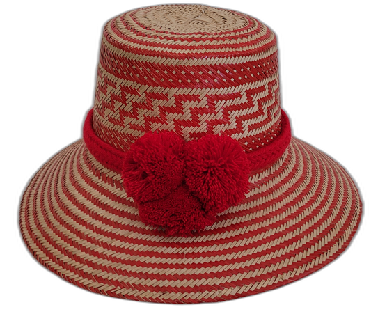 Handmade Wayuu bohemian straw hat with bright red pompoms and red-beige zigzag patterns.