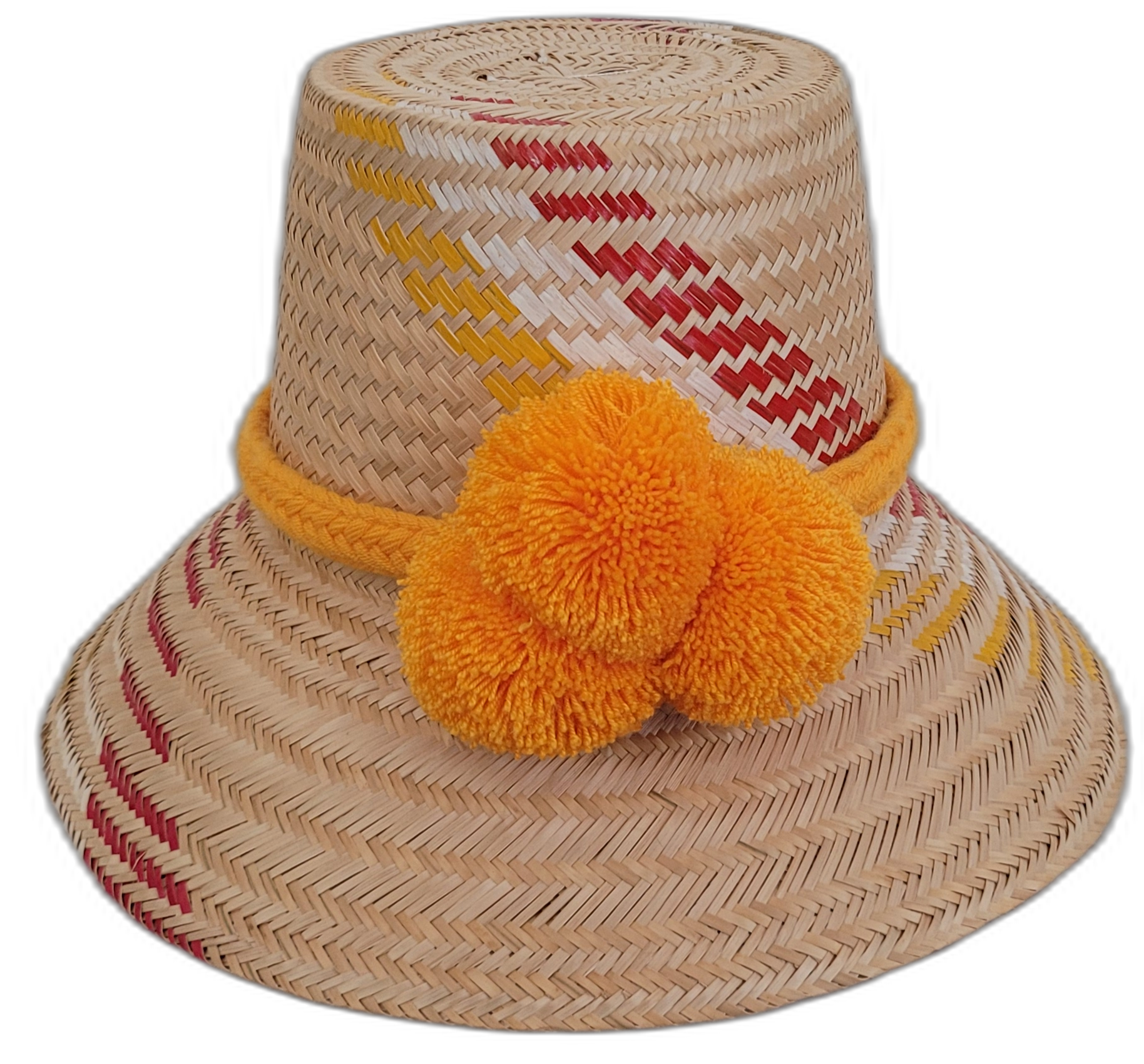 Handmade Wayuu bohemian straw hat with bright orange pompoms and yellow-red woven patterns.

