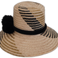 Boho-chic Wayuu straw hat featuring black pompoms and intricate design.

