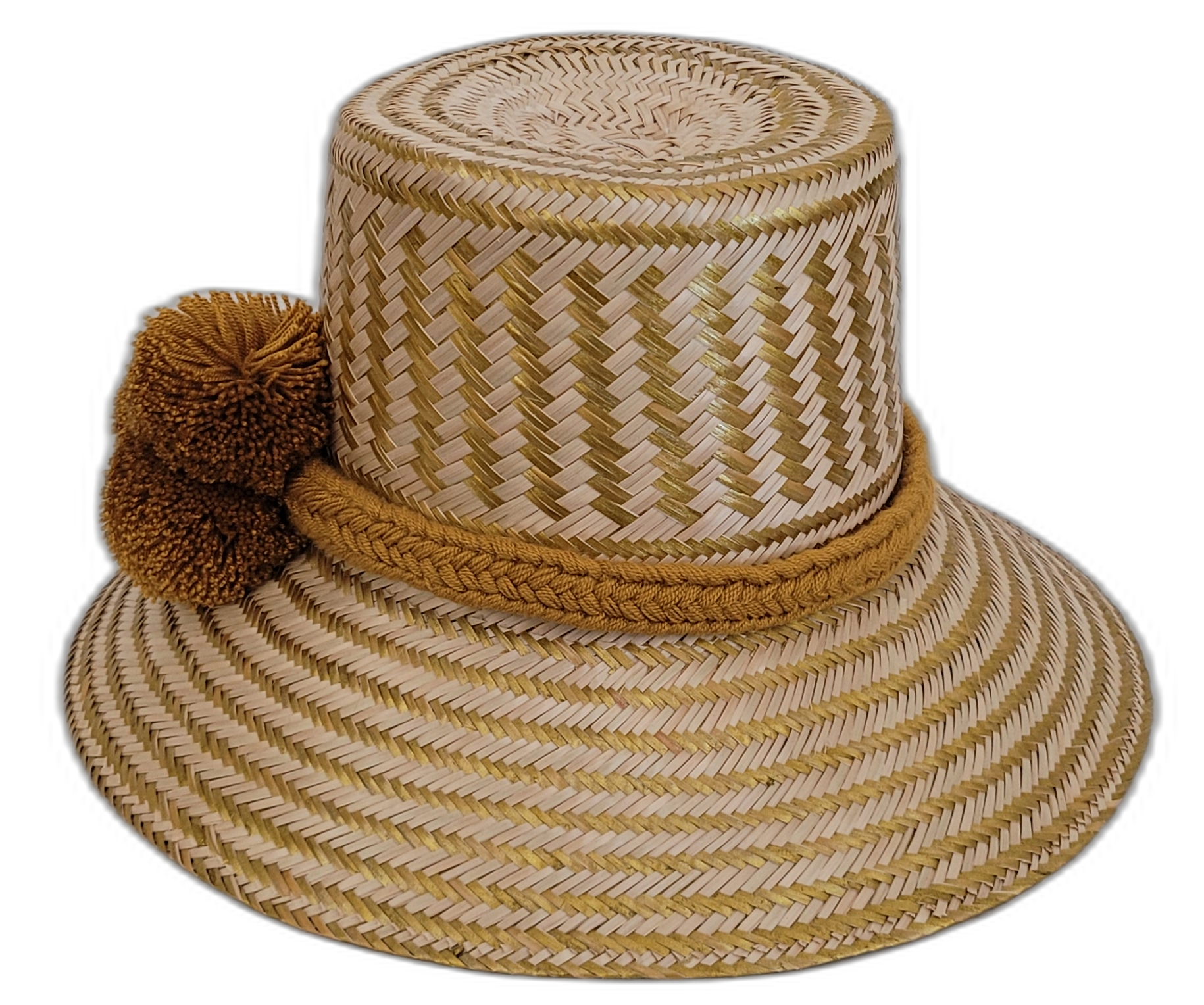 Boho-chic Wayuu straw hat featuring golden-brown pompoms and handwoven details.

