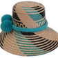 Boho-chic Wayuu straw hat featuring turquoise pompoms and handwoven details.

