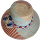 Colorful Wayuu hat with red, navy, and baby blue pompoms
