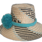 Boho chic straw hat crafted by Wayuu artisans featuring minimalist blue-on-natural design.Adalyn boho hat with bold turquoise and black design elements




