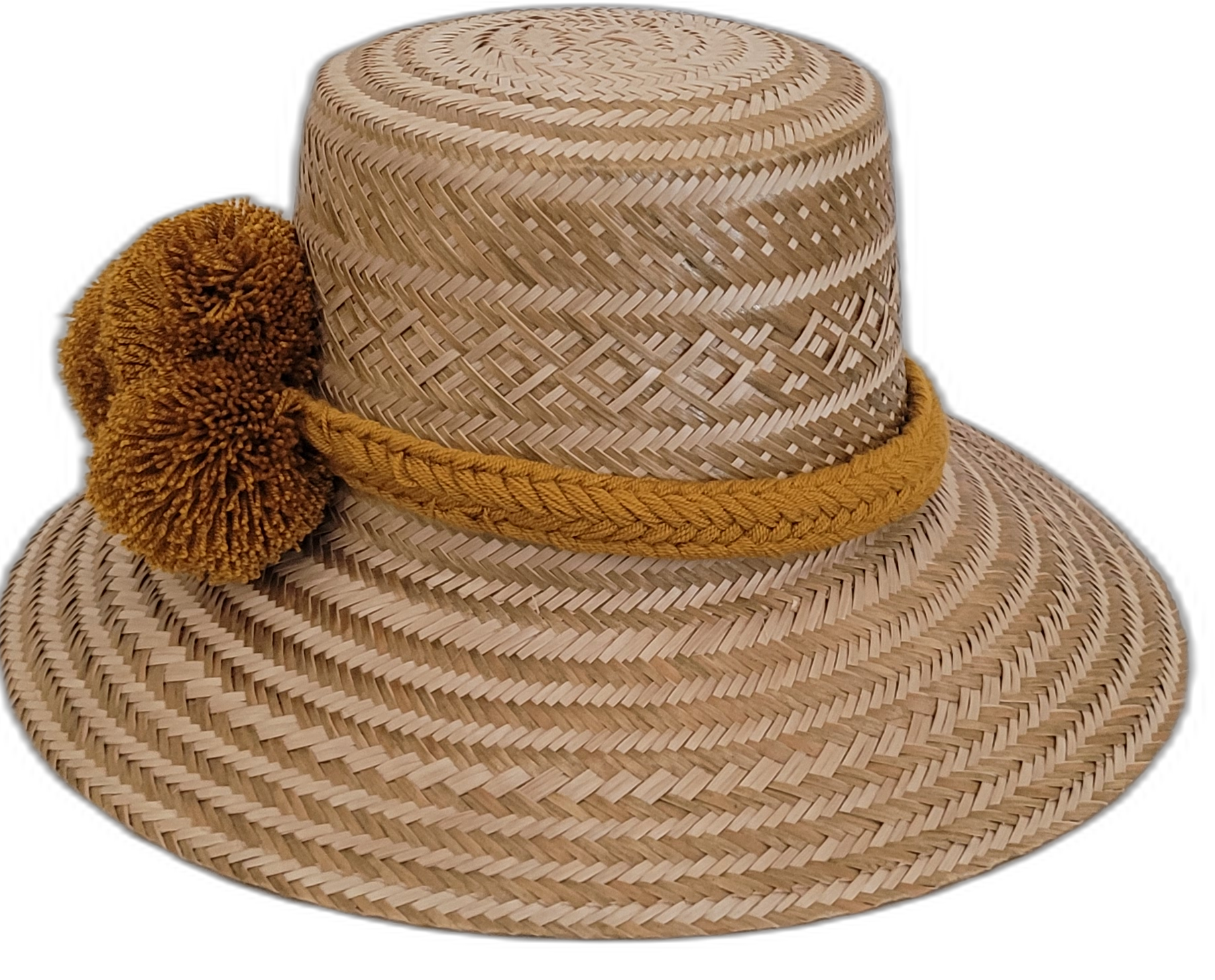 Artisan-crafted Wayuu hat in natural straw with bold golden braided pompoms.

