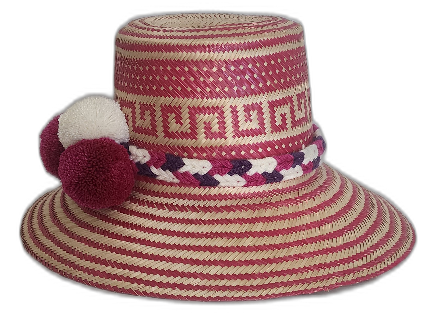 Boho straw hat featuring bold pompoms and intricate Wayuu patterns