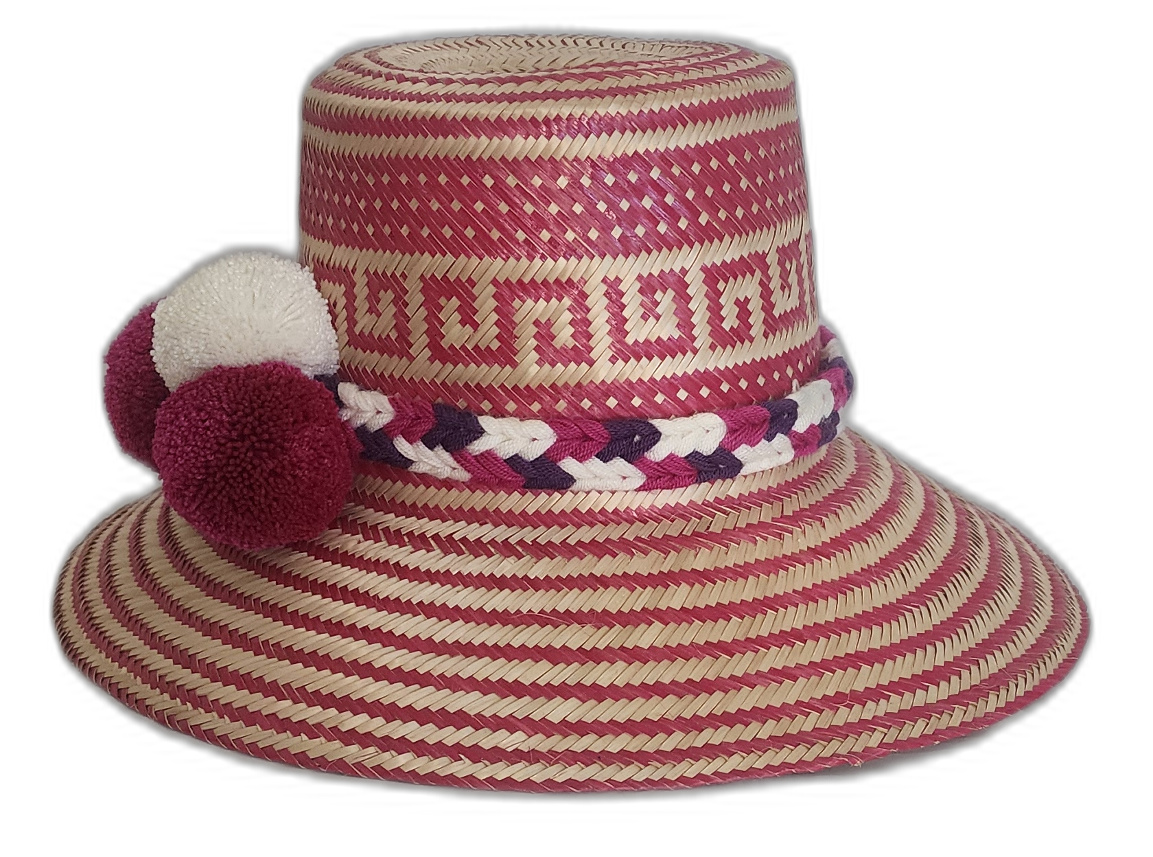 Boho straw hat featuring bold pompoms and intricate Wayuu patterns