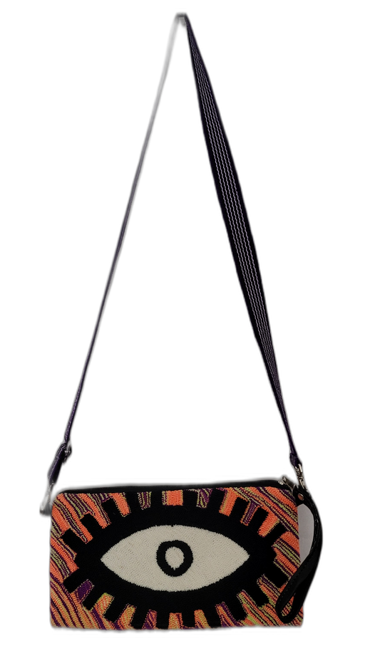 Boho punch needle clutch with bold evil eye design in black, white, purple, and orange

