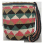 Colorful artisan Wayuu bag with woven crochet texture and long tassels — a statement boho accessory handcrafted with care.