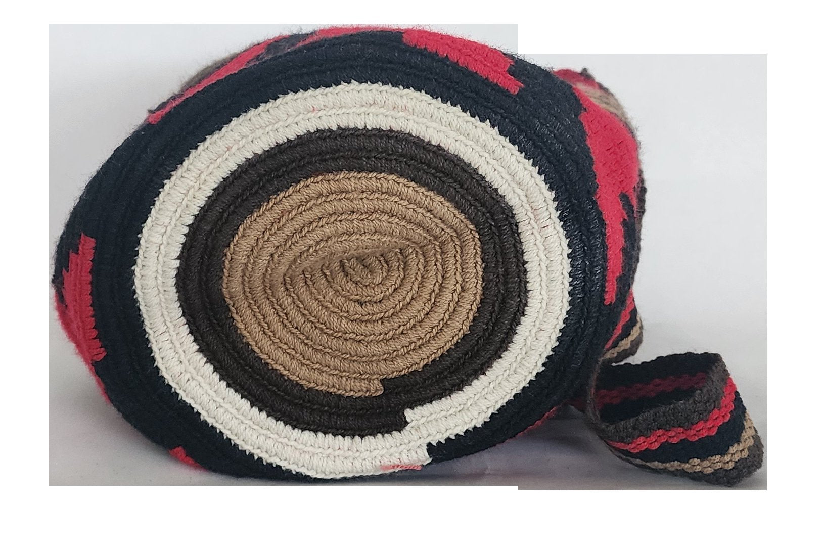 Bohemian-style crochet Wayuu mochila in earthy hues and tribal design, complete with multicolor tassels and wide strap — handmade with care.