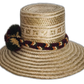 Natural straw Boho hat with intricate band and deep earthy tones.Natural straw bohemian hat with braided red-gold band and soft color pompoms


