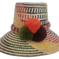 Handmade Wayuu hat in colorful straw with multicolor pompoms and woven band.Rylee handmade bohemian Wayuu hat with colorful green, red, and yellow weave

