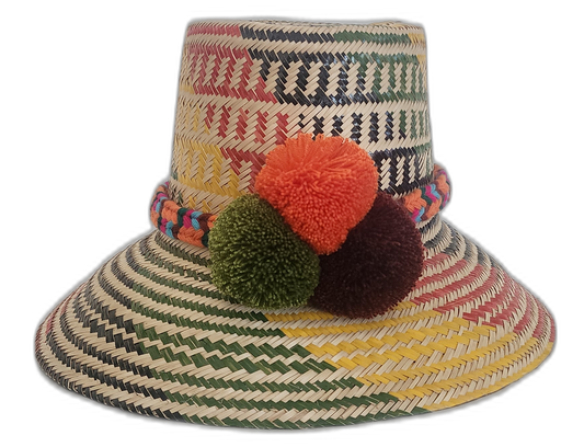Handmade Wayuu hat in colorful straw with multicolor pompoms and woven band.Rylee handmade bohemian Wayuu hat with colorful green, red, and yellow weave

