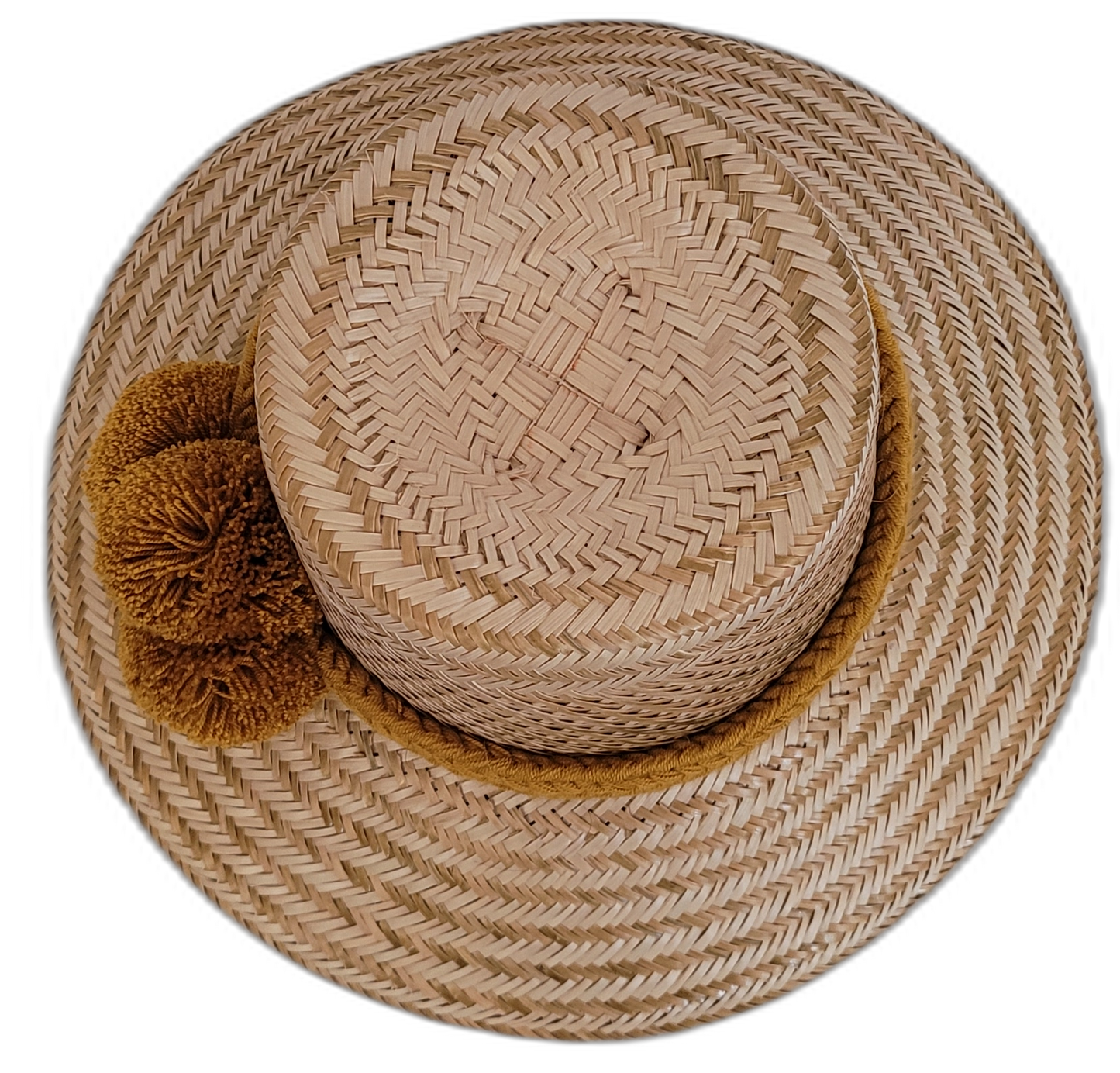 Natural Wayuu straw hat designed with warm ochre pompoms.


