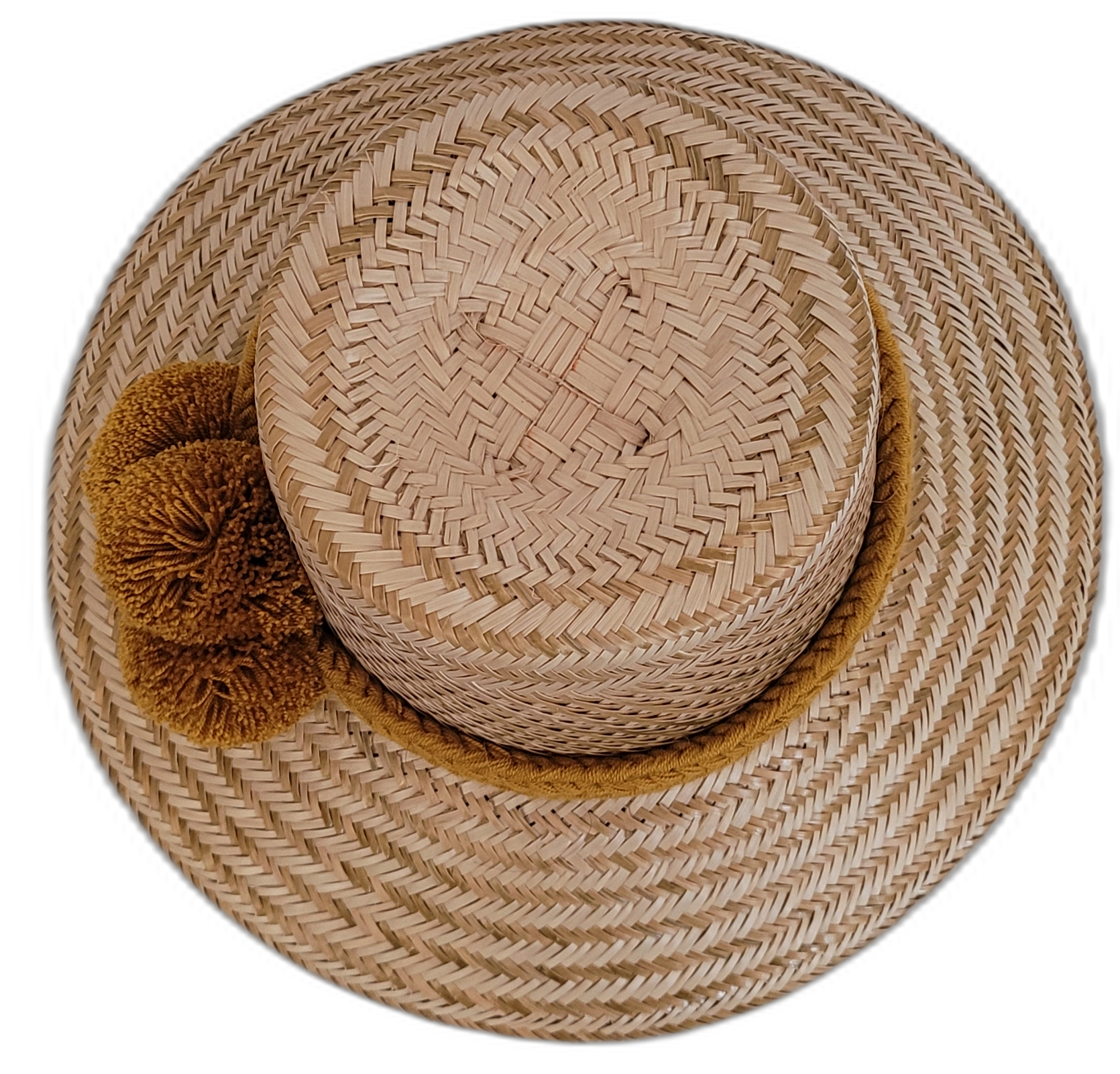 Natural Wayuu straw hat designed with warm ochre pompoms.

