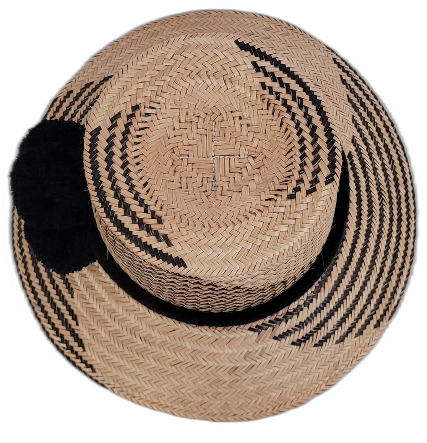 Elegant black Wayuu straw hat with bold black pompoms, artisan crafted.

