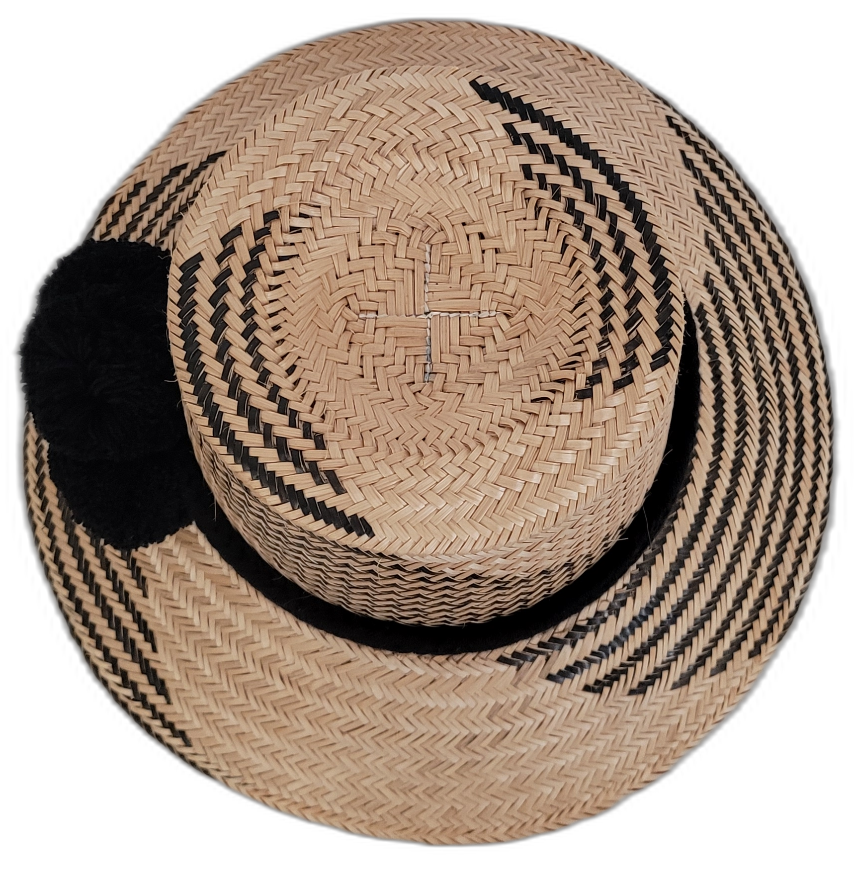 Elegant black Wayuu straw hat with bold black pompoms, artisan crafted.

